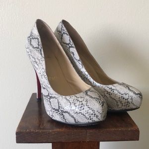 Red bottom snake print platform heels.  Size 38. Worn once.  GUC
